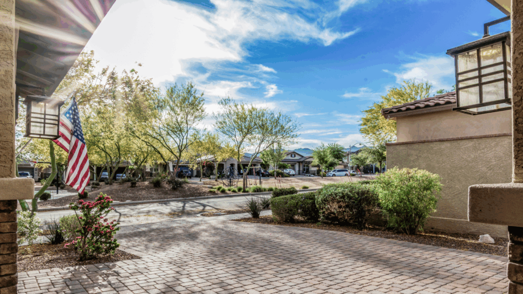 Front-porch view overlooking a park in Verrado, Buckeye AZ — one of the most popular West Valley neighborhoods near Luke AFB for military PCS homebuyers.